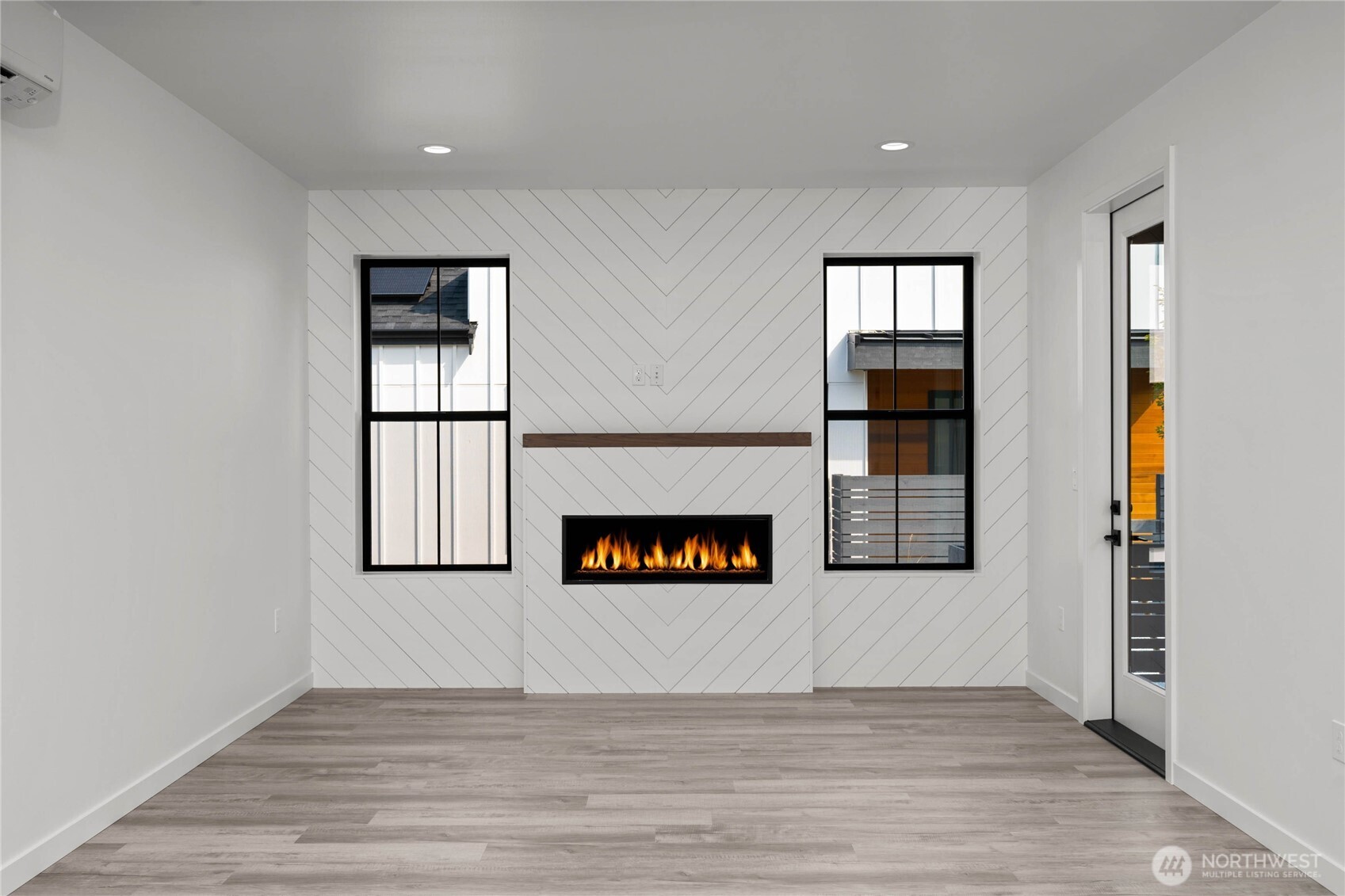 3906 Crosswinds Court Anacortes, WA 98221 - Photo 4 of 16 an entryway with wooden floor and windows