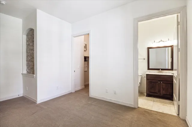 a view of a kitchen with a sink and a stove top oven