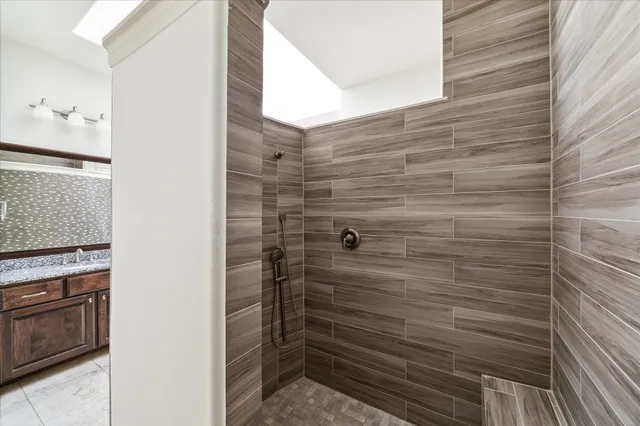 a bathroom with a shower and a stove