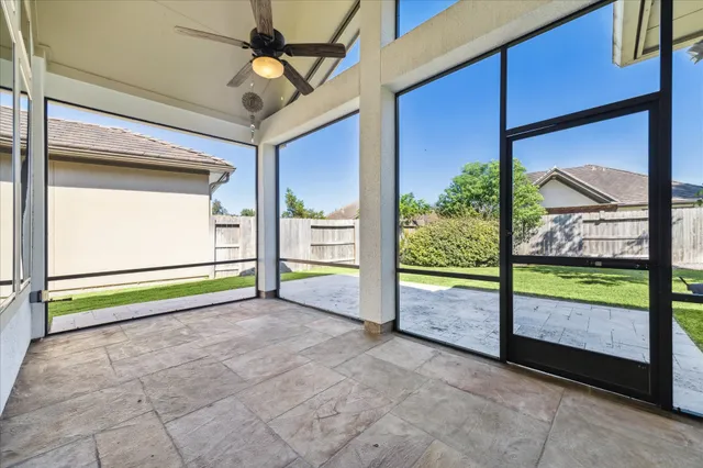 a view of back yard with porch