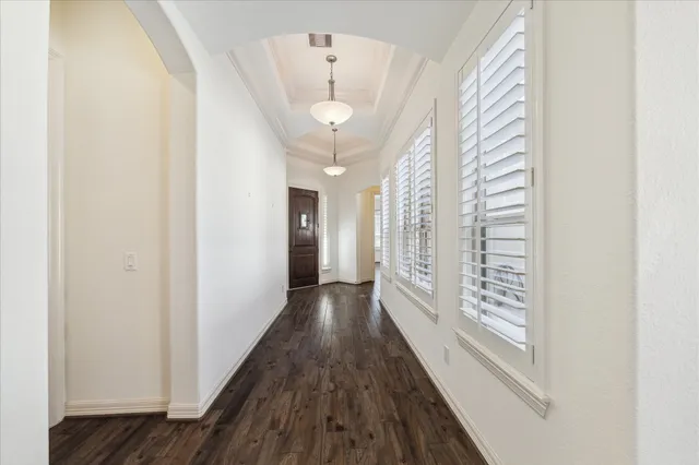 a view of gallery with wooden floor