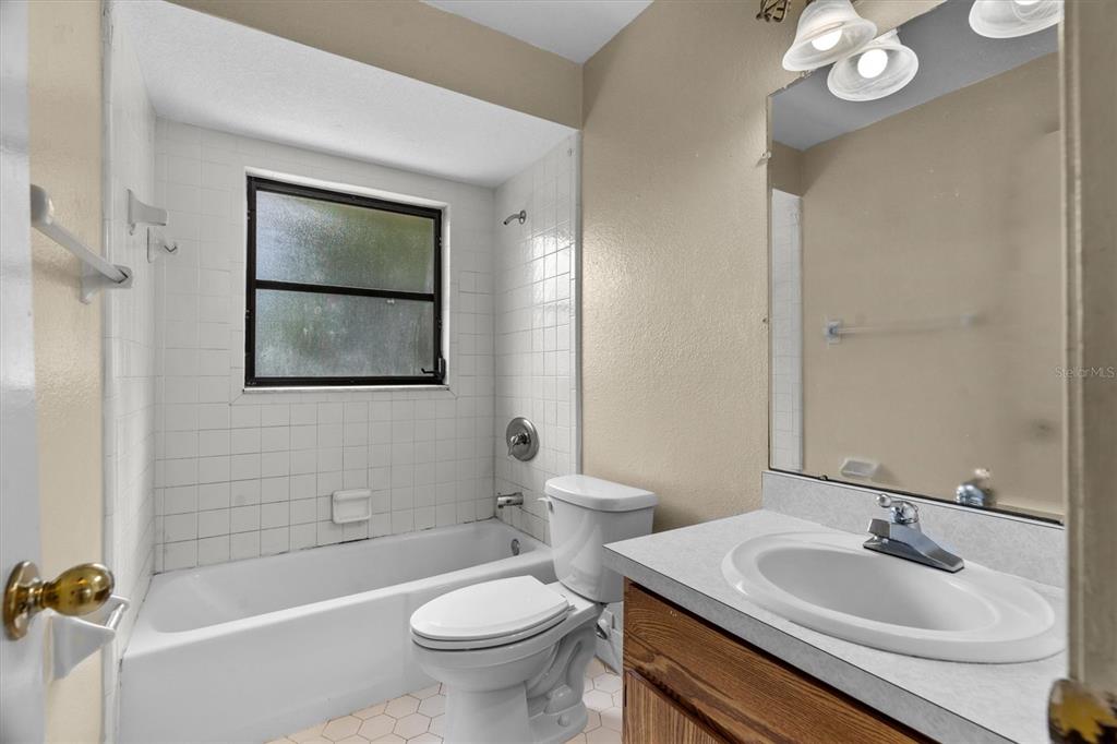27242 Sunnybrook Road Punta Gorda, FL 33983 - Photo 13 of 36 a bathroom with a sink toilet and shower