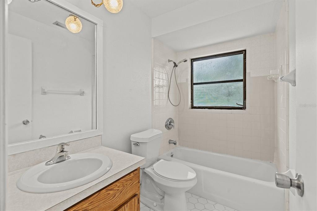 27242 Sunnybrook Road Punta Gorda, FL 33983 - Photo 25 of 36 a bathroom with a sink toilet and shower