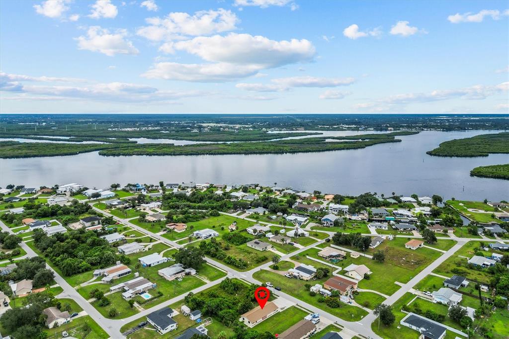 27242 Sunnybrook Road Punta Gorda, FL 33983 - Photo 33 of 36 a view of a lake with houses