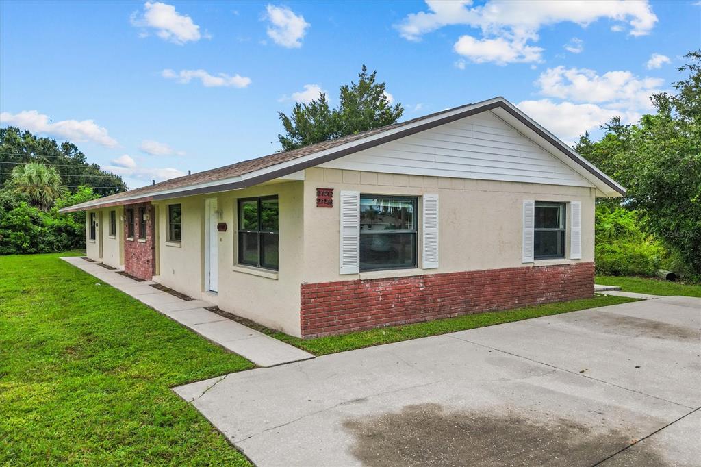 27242 Sunnybrook Road Punta Gorda, FL 33983 - Photo 4 of 36 a front view of house with yard and green space