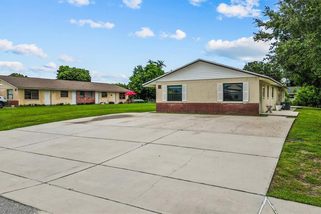 27242 Sunnybrook Road Punta Gorda, FL 33983 - Photo 5 of 36 a front view of house with yard and green space