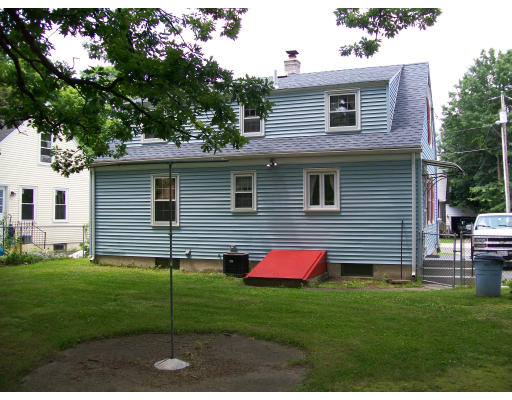 13 Schley Street Springfield, MA 01109 - Photo 4 of 5 a backyard of a house with table and chairs