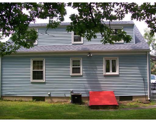 13 Schley Street Springfield, MA 01109 - Photo 5 of 5 a view of a house with a small yard and a large tree