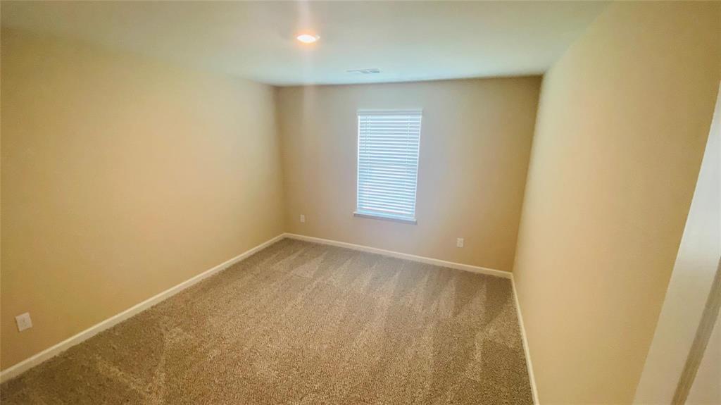 261 Moonstone Way Princeton, TX 75407 - Photo 5 of 9 an empty room with a window