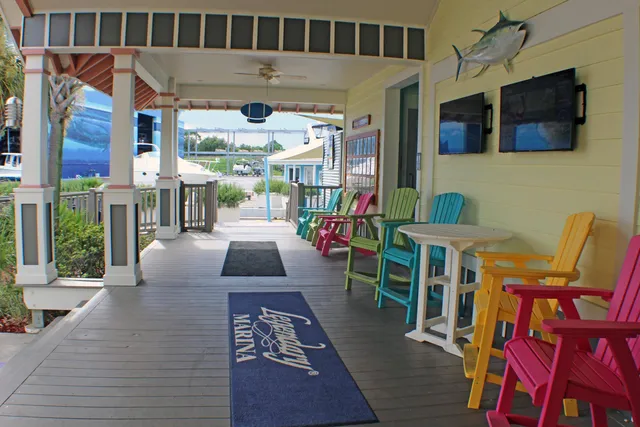 a view of a livingroom with workspace and a window