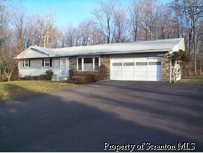 16 Springhill Road Sterling, PA 18463 - Photo 1 of 1 a view of house with yard and trees in the background