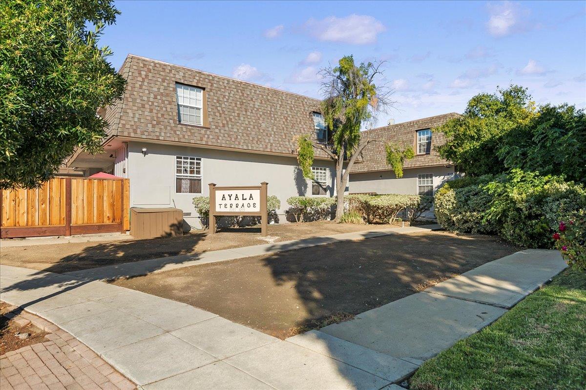 1285 Ayala Drive Sunnyvale, CA 94086 - Photo 2 of 23 a front view of a house with a yard and a garage