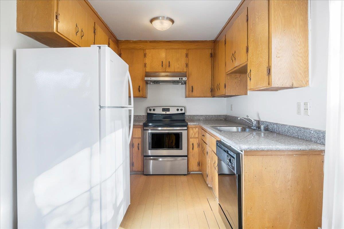 1285 Ayala Drive Sunnyvale, CA 94086 - Photo 12 of 23 a kitchen with a sink a stove and a refrigerator