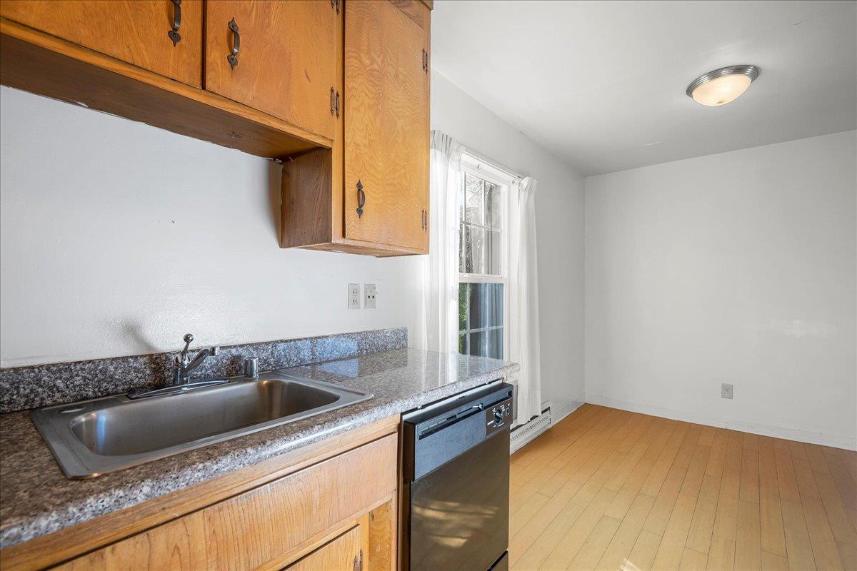 1285 Ayala Drive Sunnyvale, CA 94086 - Photo 13 of 23 a kitchen with a sink and cabinets