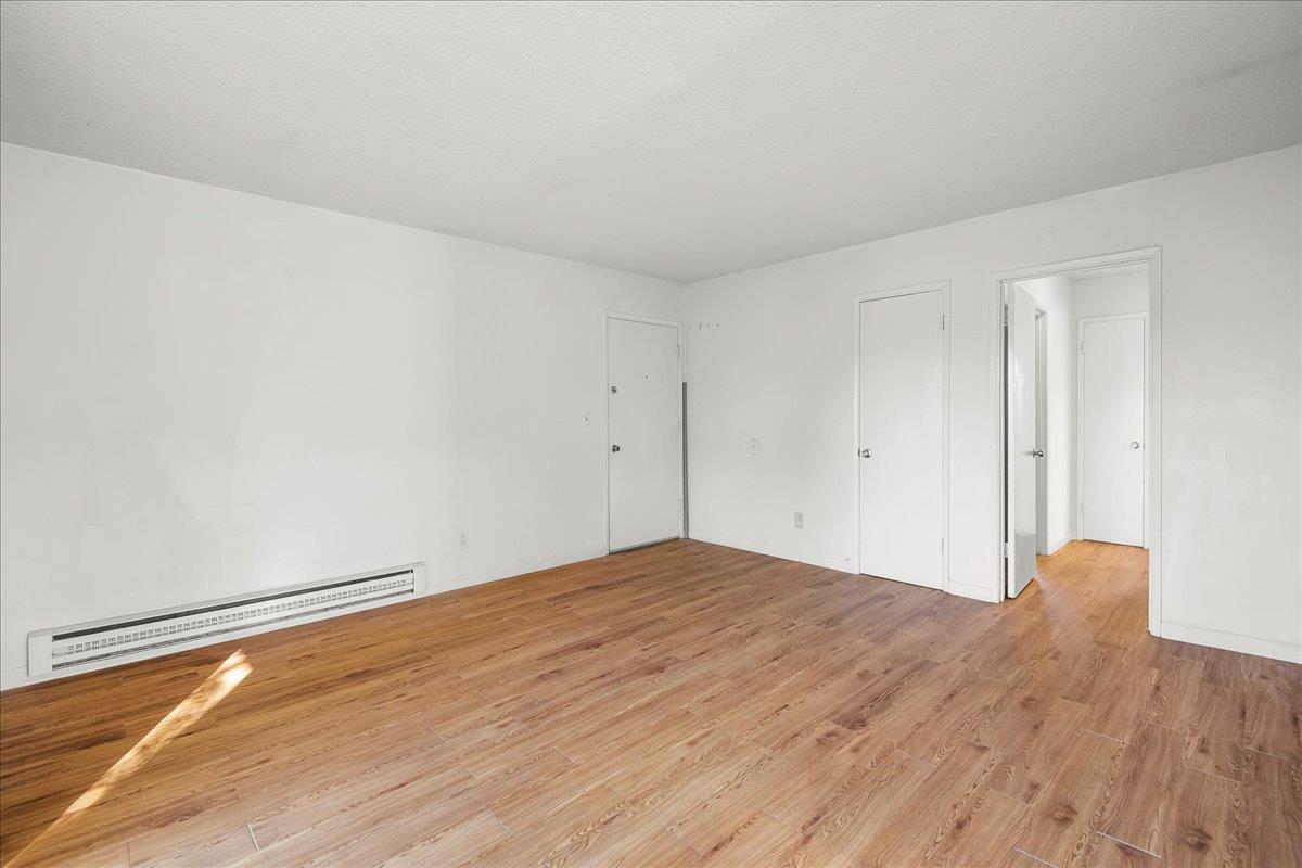 1285 Ayala Drive Sunnyvale, CA 94086 - Photo 22 of 23 a view of empty room with wooden floor
