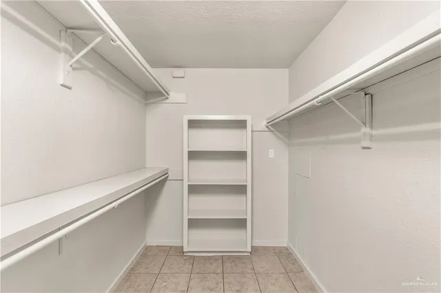 a view of an empty walk in closet