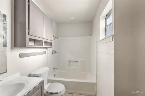 a bathroom with a toilet sink and a bathtub