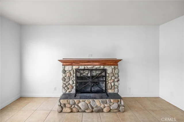 a view of fireplace and wooden floor