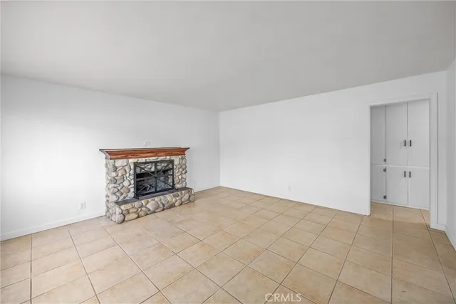 an empty room with a fireplace