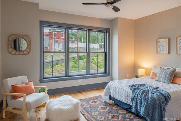 a bedroom with a bed and chair