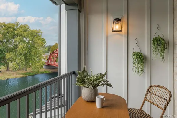 a view of balcony with chair and potted plant