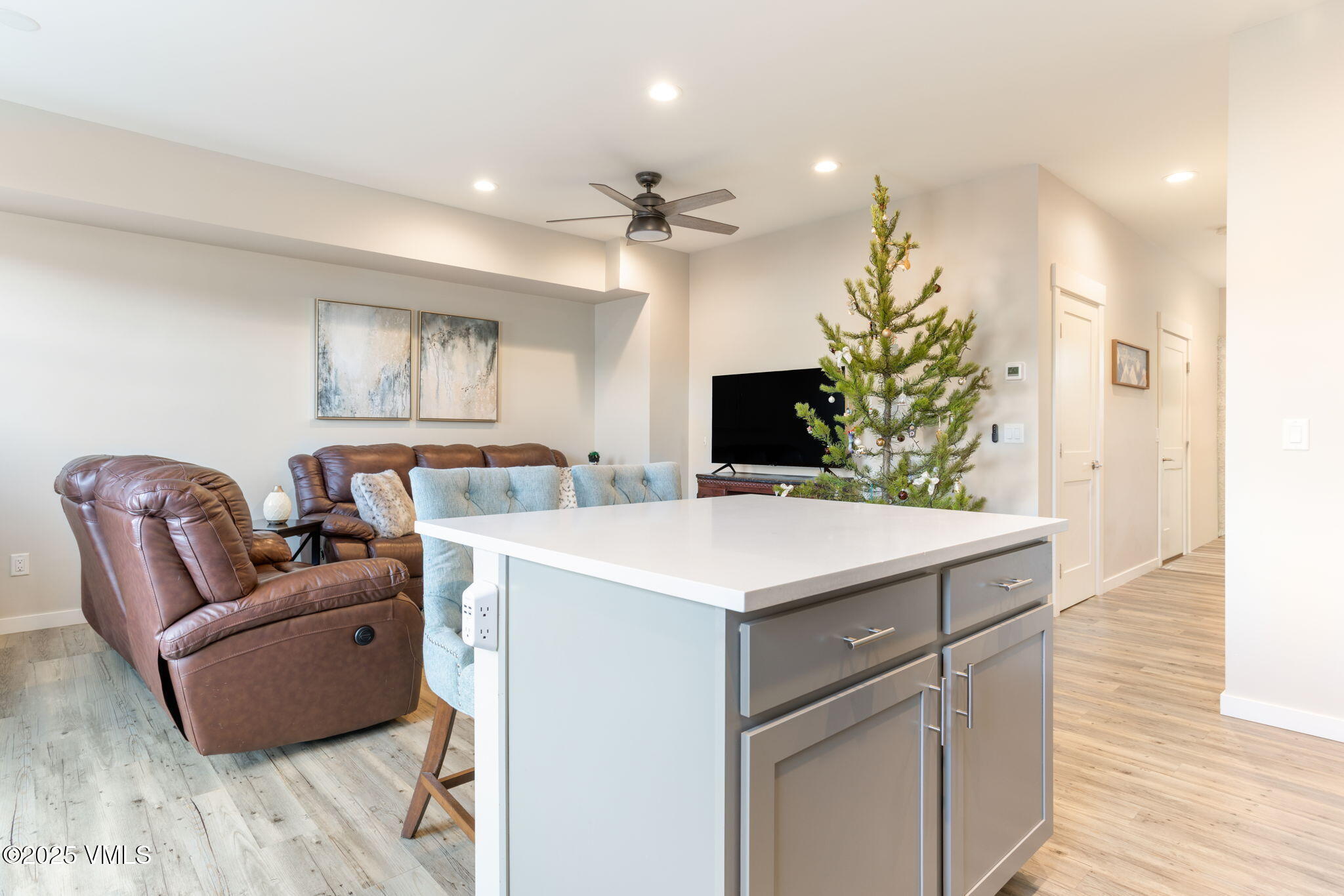406 Chickadee Lane Gypsum, CO 81637 - Photo 12 of 24 a living room with furniture and a chandelier