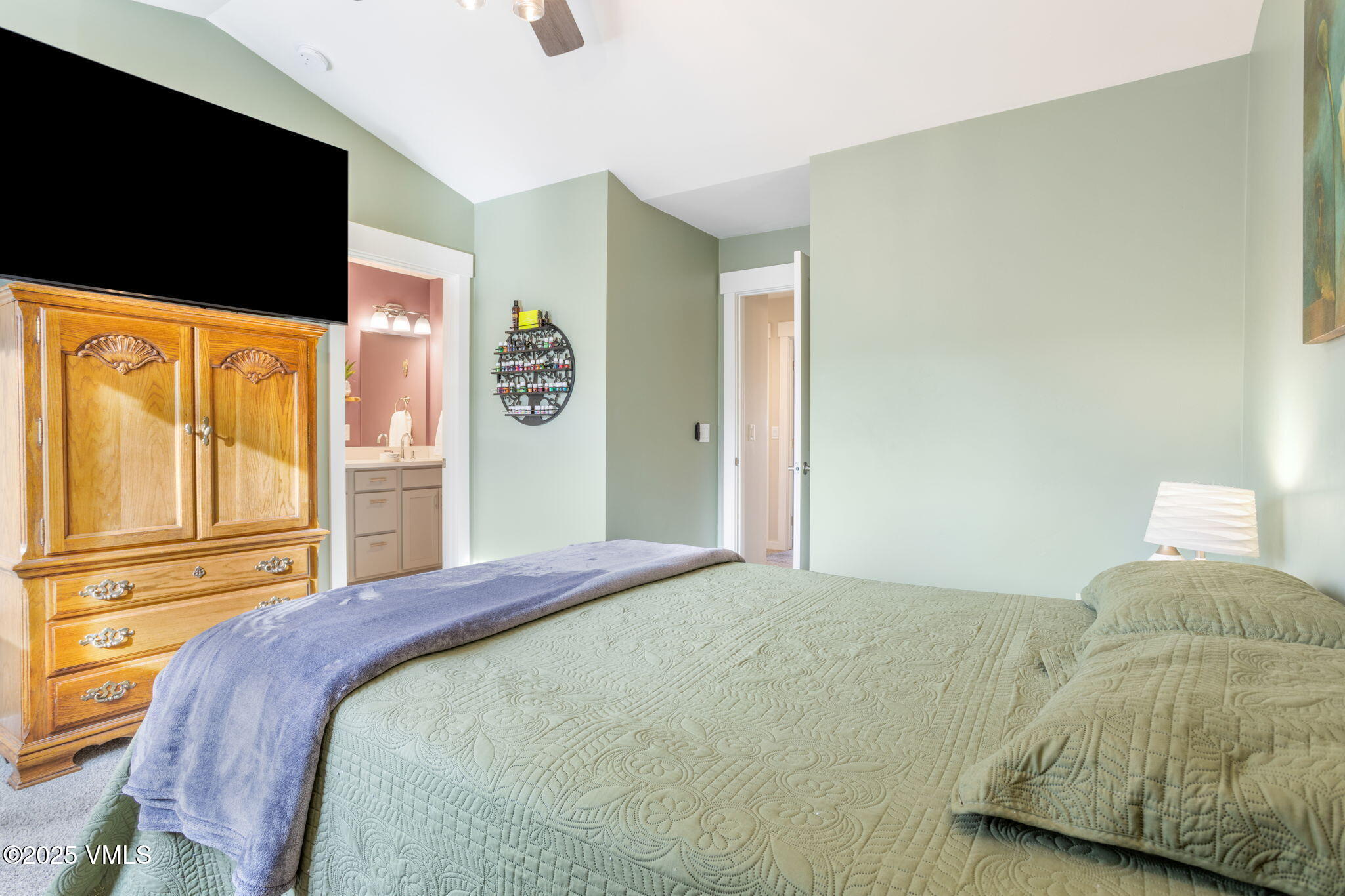 406 Chickadee Lane Gypsum, CO 81637 - Photo 15 of 24 a bedroom with a bed and flat screen tv