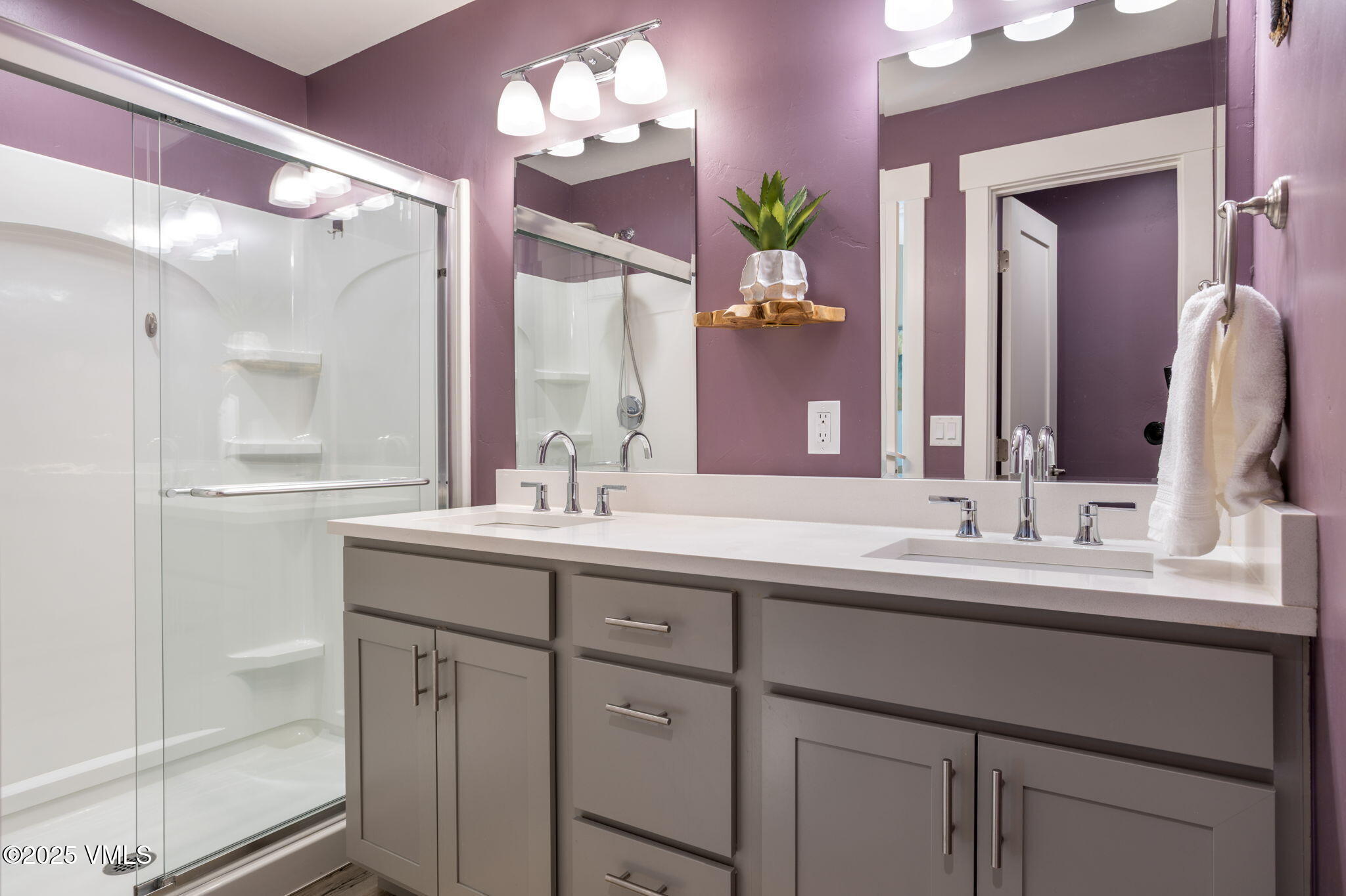 406 Chickadee Lane Gypsum, CO 81637 - Photo 16 of 24 a bathroom with a double vanity sink and a mirror