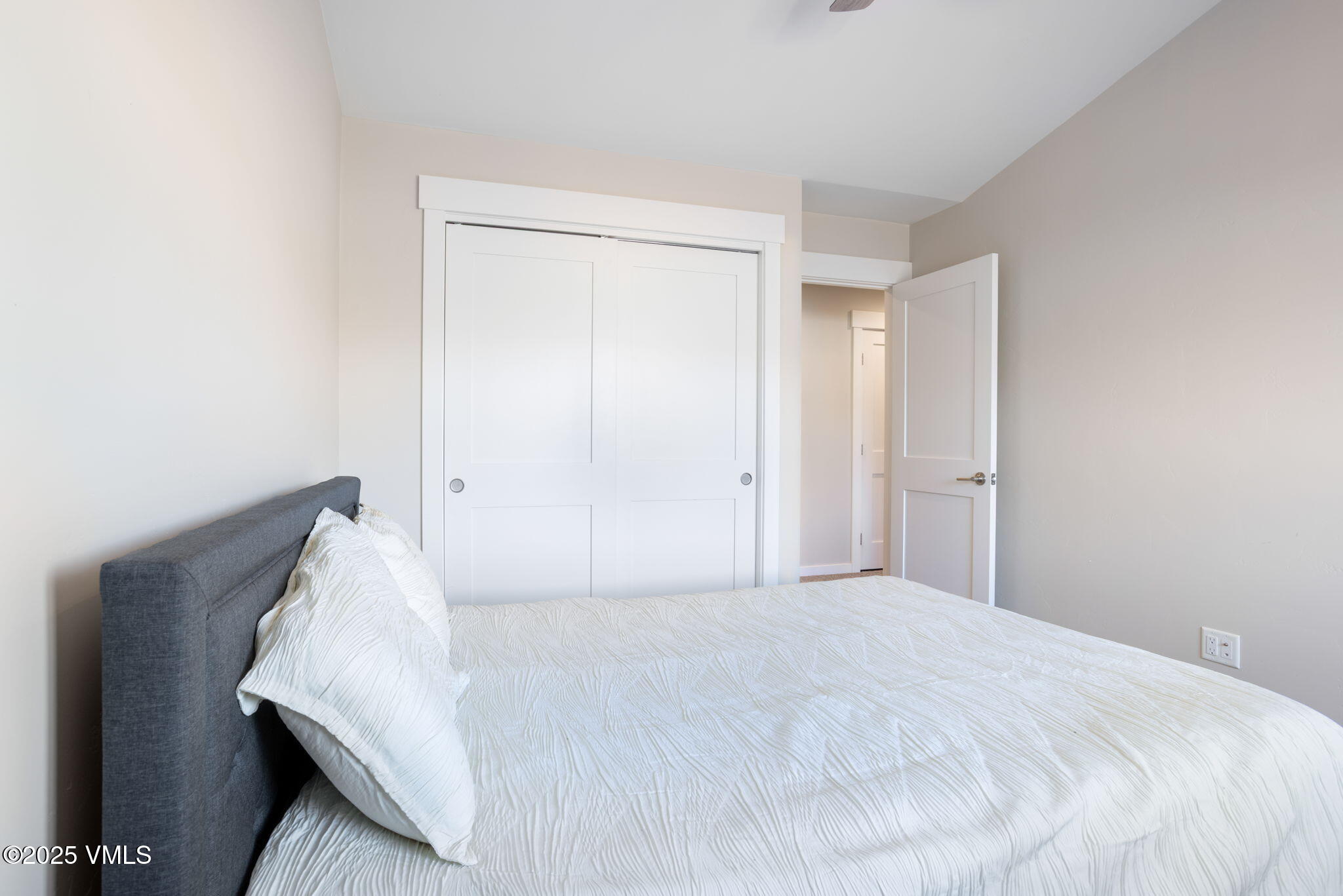 406 Chickadee Lane Gypsum, CO 81637 - Photo 20 of 24 a bedroom with a bed and a night stand