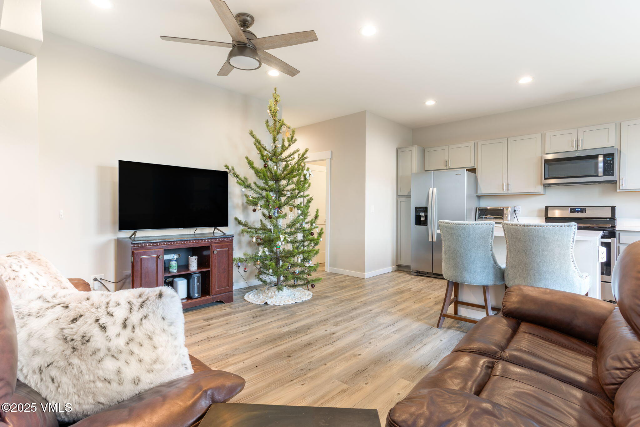 406 Chickadee Lane Gypsum, CO 81637 - Photo 5 of 24 a living room with furniture and a flat screen tv