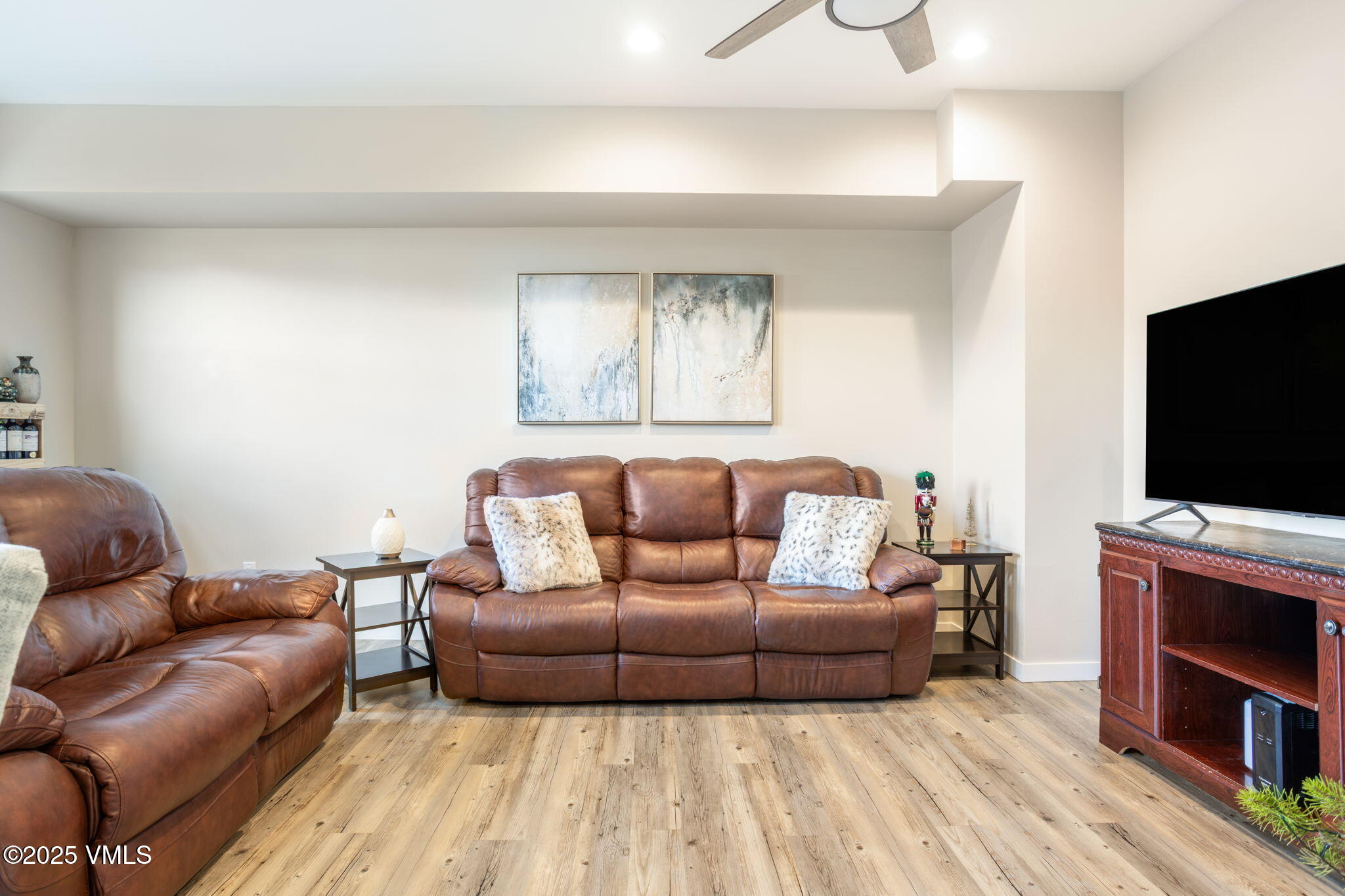 406 Chickadee Lane Gypsum, CO 81637 - Photo 7 of 24 a living room with furniture and a flat screen tv