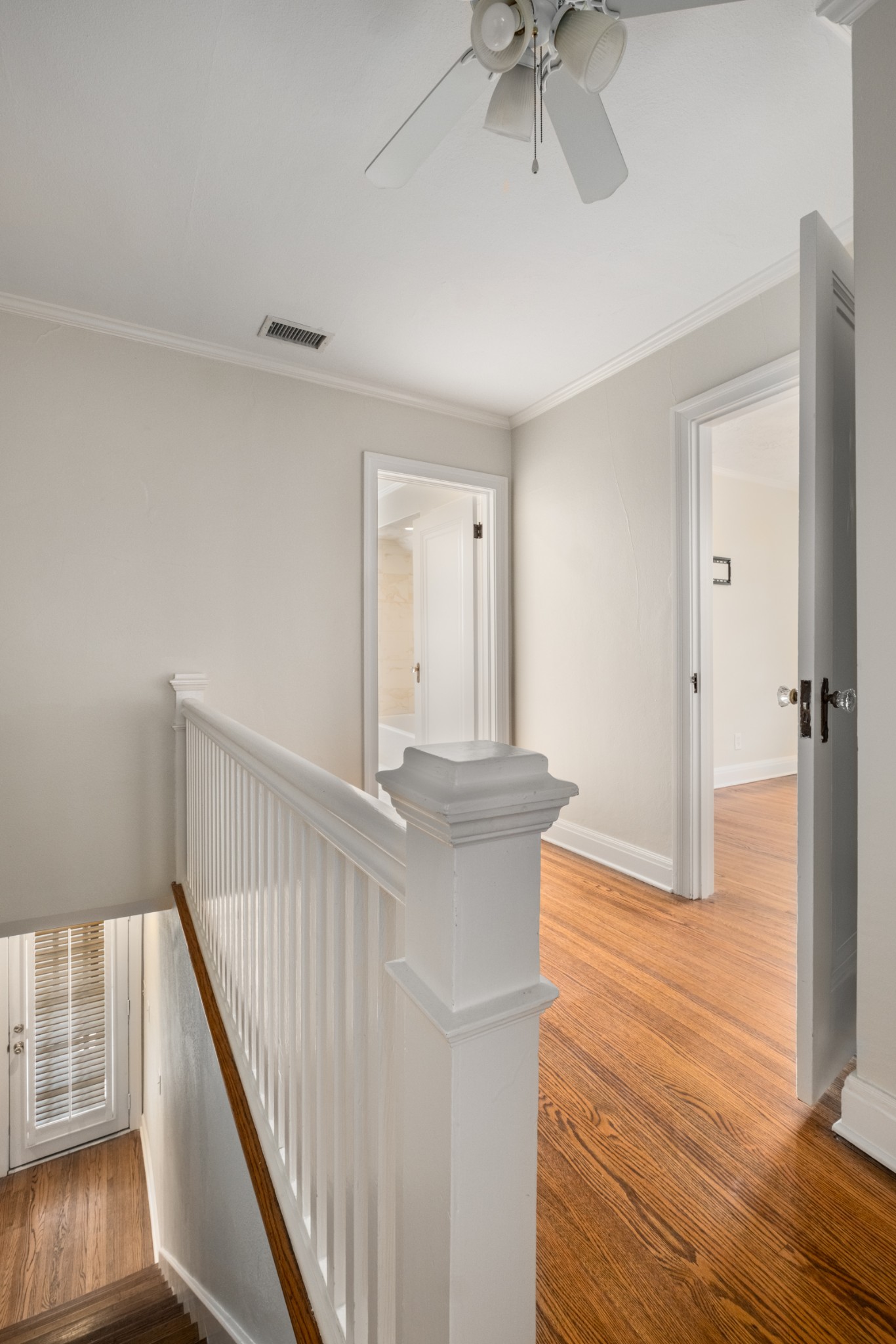 205 Mockingbird Road Nashville, TN 37205 - Photo 11 of 18 a view of a hallway with wooden floor and chandelier