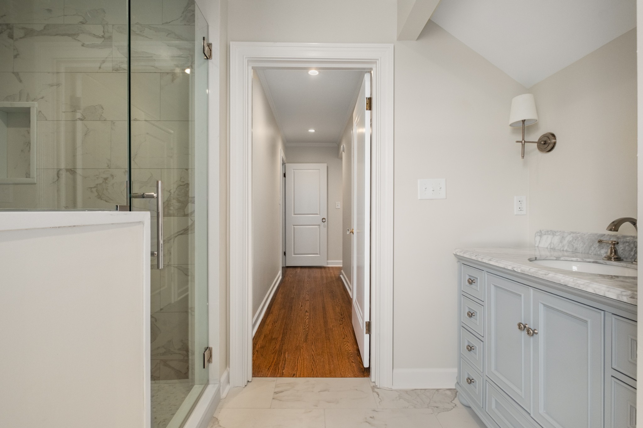 205 Mockingbird Road Nashville, TN 37205 - Photo 13 of 18 a en suite bathroom with a granite countertop sink and a mirror