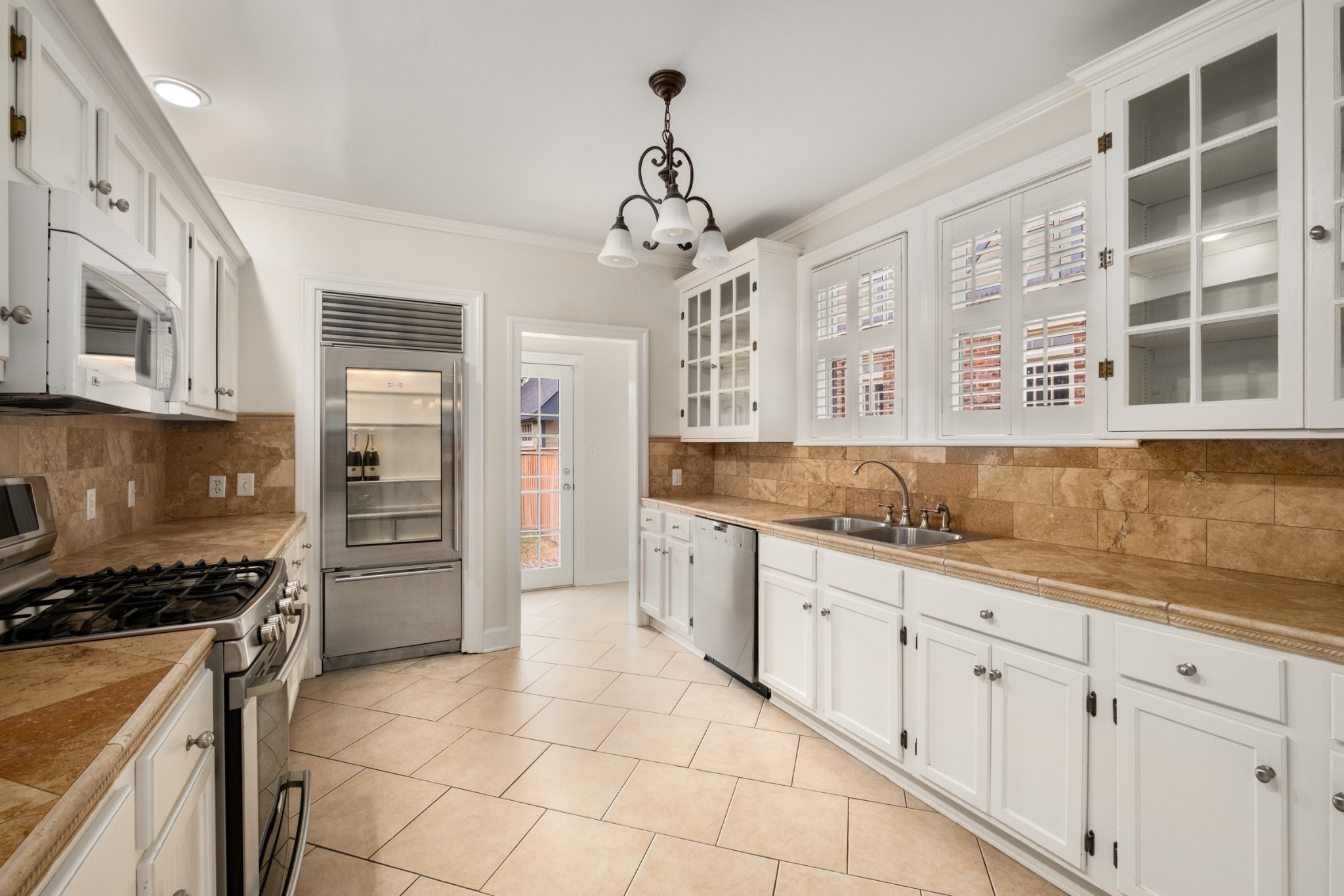 205 Mockingbird Road Nashville, TN 37205 - Photo 6 of 18 a kitchen with cabinets and window