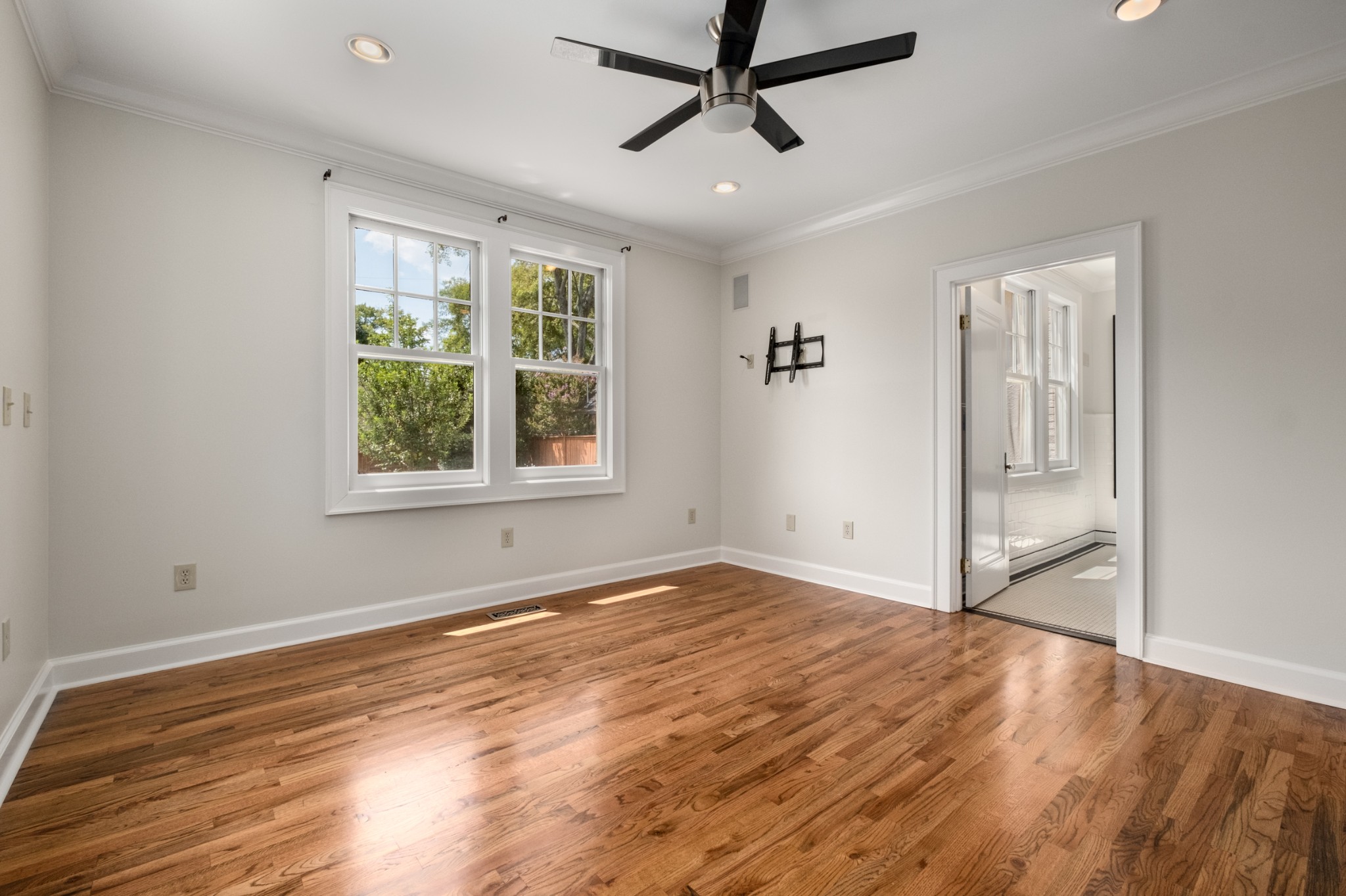 205 Mockingbird Road Nashville, TN 37205 - Photo 8 of 18 a view of empty room with wooden floor and fan