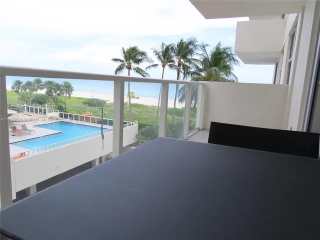 a view of swimming pool from a balcony
