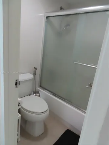 a front view of a house with garden space and stairs