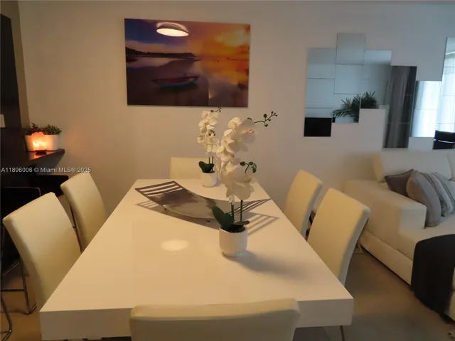 a living room with furniture fireplace and flat screen tv