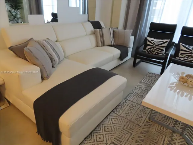 a kitchen with a stove a sink and a microwave