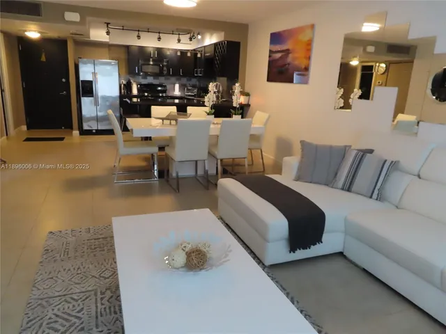 a living room with large windows