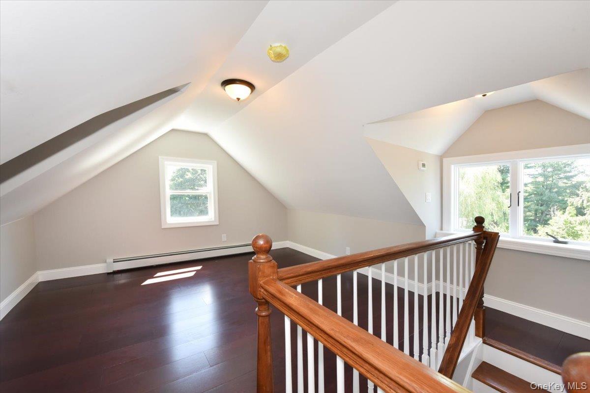 87 Dunlop Road Huntington, NY 11743 - Photo 24 of 31 a view of a hallway with windows