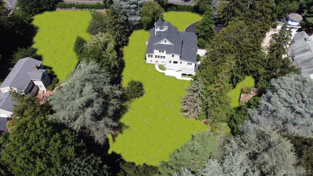 87 Dunlop Road Huntington, NY 11743 - Photo 29 of 31 an aerial view of a house with a yard swimming pool outdoor seating and yard