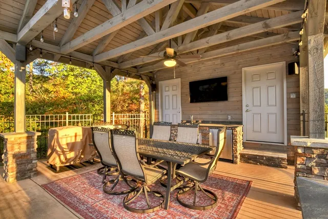 a view of a patio with table and chairs