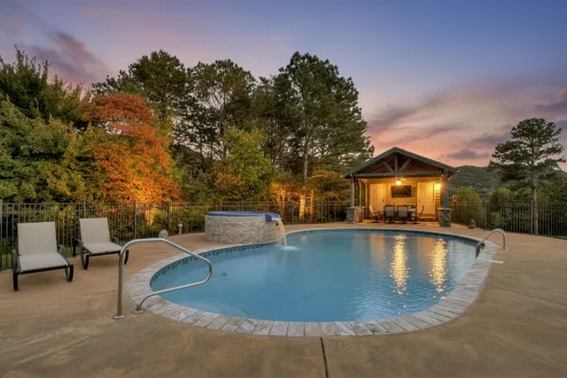 a view of a swimming pool with lounge chair
