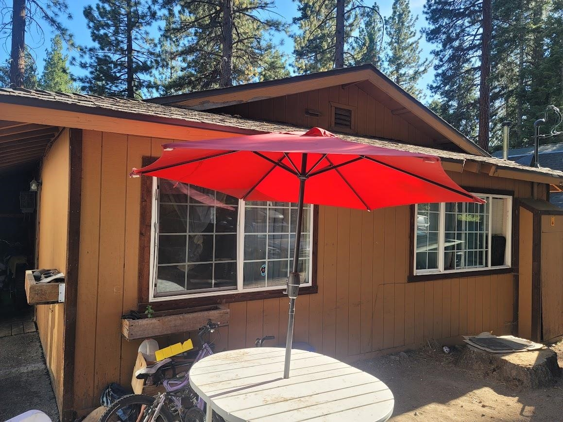 8630 Steelhead Avenue, Unit 13 Kings Beach, CA 96143 - Photo 15 of 28 a blue and red umbrella sitting in front of a house