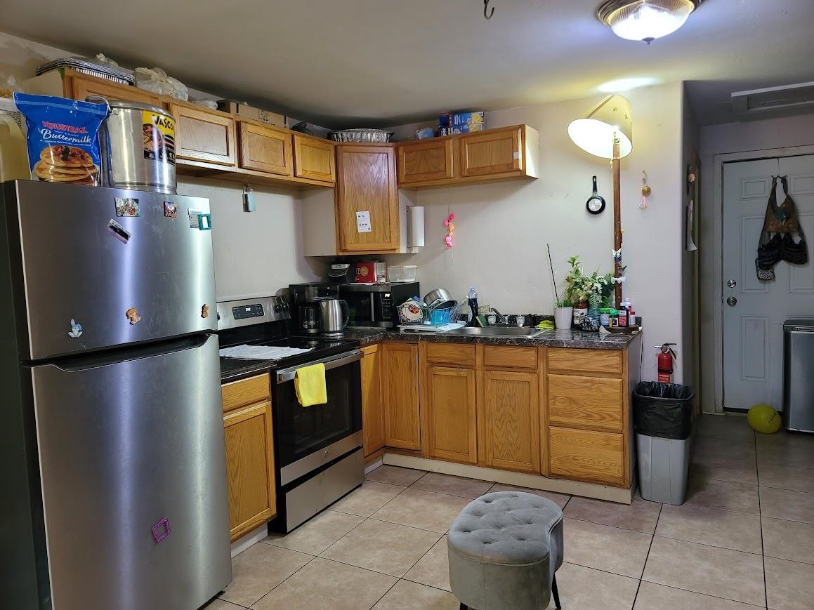 8630 Steelhead Avenue, Unit 13 Kings Beach, CA 96143 - Photo 18 of 28 a kitchen with stainless steel appliances granite countertop a refrigerator a stove and a sink
