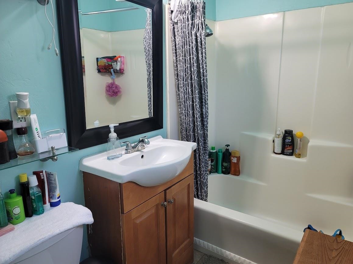 8630 Steelhead Avenue, Unit 13 Kings Beach, CA 96143 - Photo 24 of 28 a bathroom with a sink and a mirror