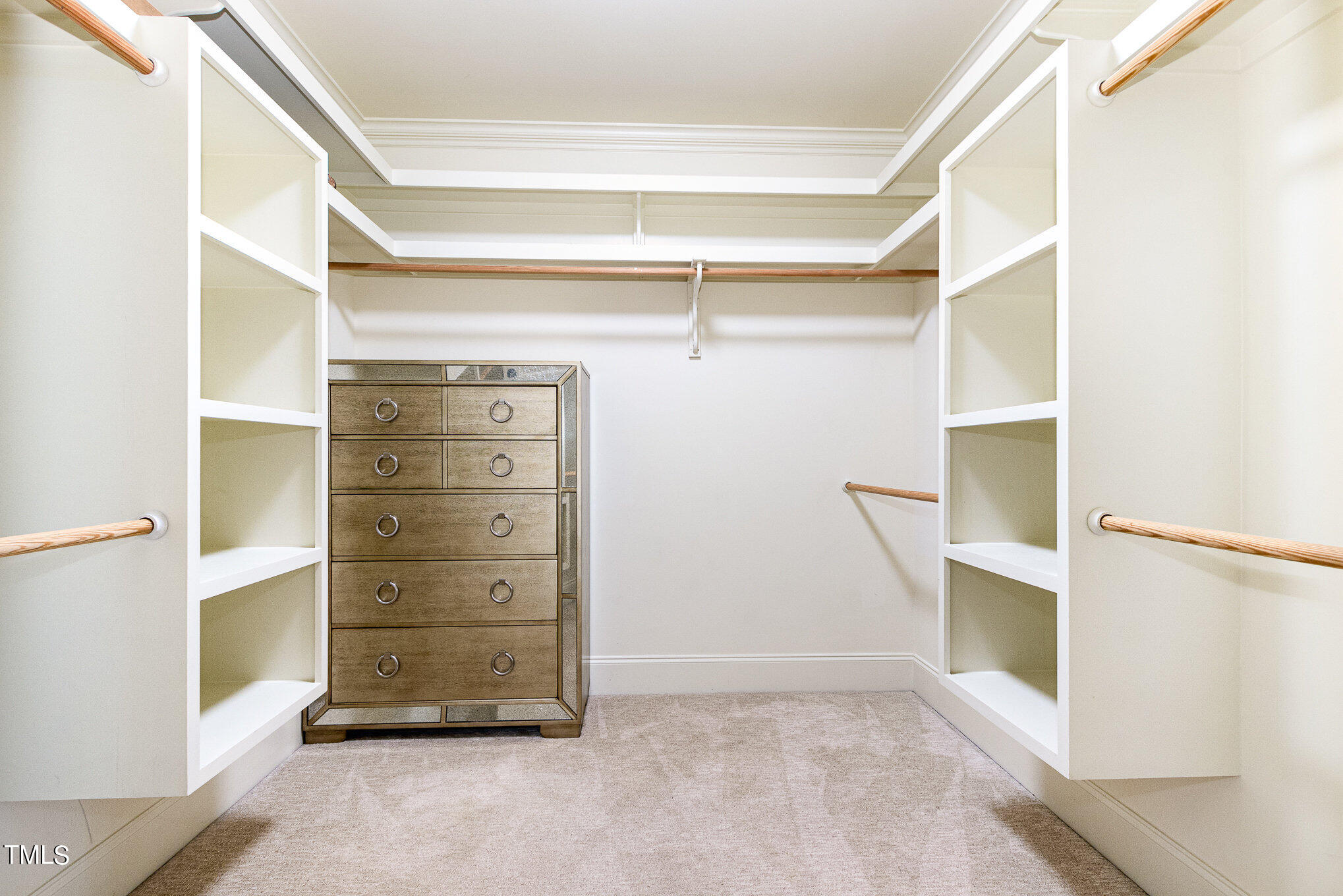7814 Monument Lane Raleigh, NC 27615 - Photo 24 of 52 One of two separate closets between bedroom and bath offers space for dressers