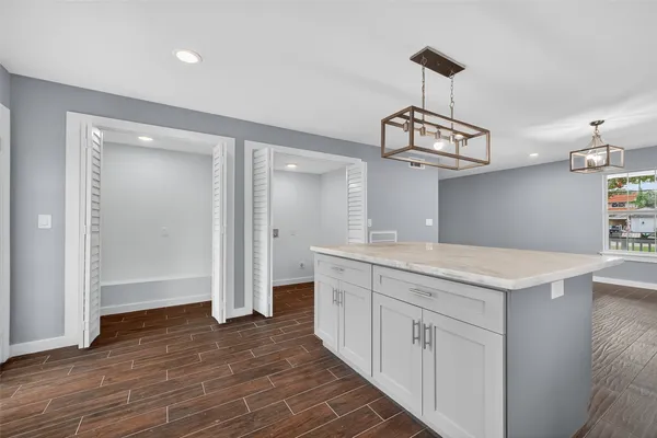 a bathroom with a sink a mirror and a shower