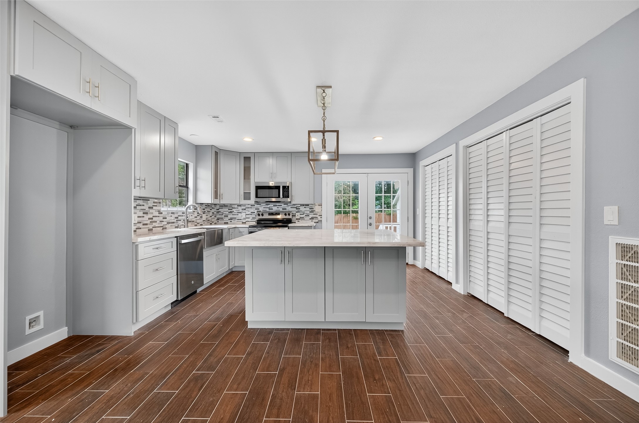 1933 Santa Rosa Street Houston, TX 77023 - Photo 23 of 44 a kitchen with a refrigerator and white cabinets